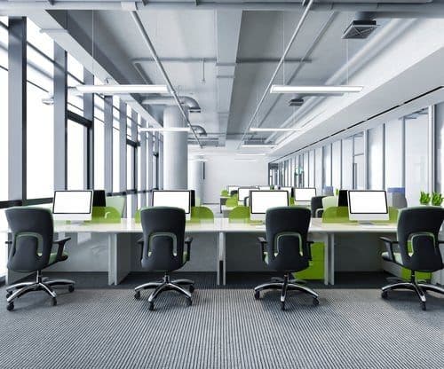 Clean modern open-plan office with tidy desks after a commercial cleaning service