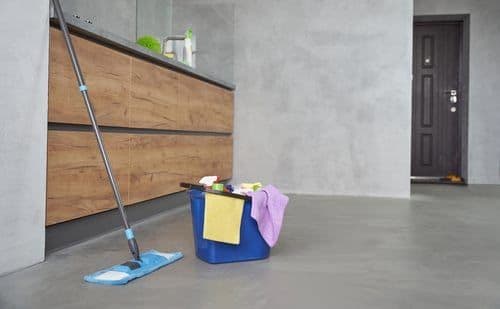 Freshly cleaned modern interior with a mop and cleaning caddy, Chicago