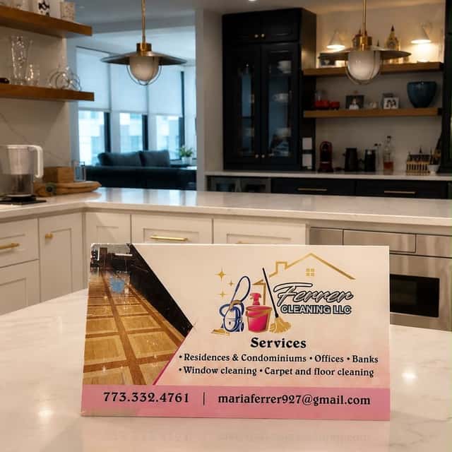 Ferrer Cleaning business card on a kitchen island listing residential, office and carpet services — Ferrer Cleaning, Chicago, IL