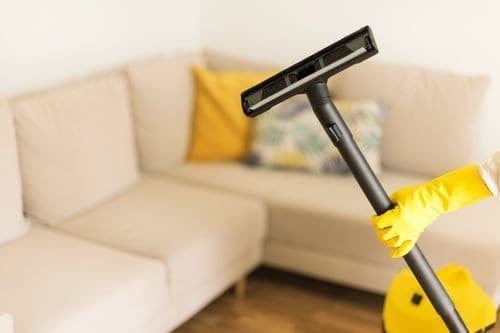 Vacuuming a bright, tidy living room during a residential house cleaning in Chicago